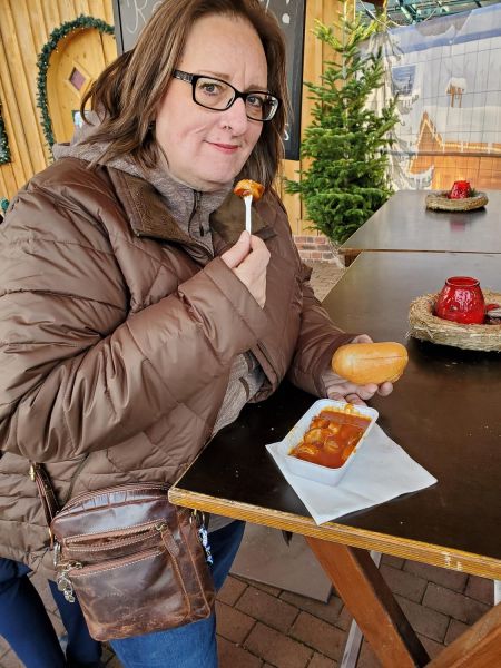 enjoying a currywurst at the Christmas Market at the CentrO in Oberhausen